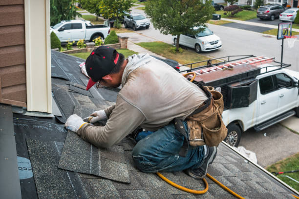 Professional Roofing technician working in Hudson, MA